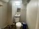A basement bathroom area with a toilet and sink at 667 E Edgewood Ave, Indianapolis, IN 46227