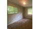 Bedroom featuring neutral walls and carpet floors, ready for personal customization and styling at 667 E Edgewood Ave, Indianapolis, IN 46227