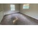 Bright bedroom featuring neutral walls, carpeted floors, and two windows for ample natural light at 667 E Edgewood Ave, Indianapolis, IN 46227