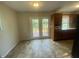 Bright dining area with access to the deck and featuring tile floors and ample cabinet space at 667 E Edgewood Ave, Indianapolis, IN 46227