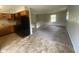 Open kitchen featuring wood cabinets, linoleum flooring, and a refrigerator at 667 E Edgewood Ave, Indianapolis, IN 46227