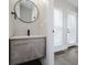 Modern bathroom featuring vanity with stone countertop and black hardware at 704 Parkway Ave, Indianapolis, IN 46203