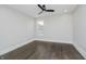 Bedroom with hardwood floors, white trim, ceiling fan and single window for natural light at 704 Parkway Ave, Indianapolis, IN 46203