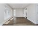 Sunlit bedroom with hardwood floors and ample natural light from large windows at 704 Parkway Ave, Indianapolis, IN 46203