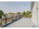 Spacious rooftop deck with metal railings and neighborhood views at 704 Parkway Ave, Indianapolis, IN 46203