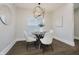 Cozy dining room with round table, modern lighting, and neutral decor at 704 Parkway Ave, Indianapolis, IN 46203