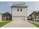 Modern home exterior featuring large garage door and sleek design at 704 Parkway Ave, Indianapolis, IN 46203