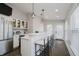 Modern kitchen featuring stainless steel appliances, bar seating, and plenty of storage space at 704 Parkway Ave, Indianapolis, IN 46203