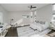 Bright main bedroom suite with large windows, ceiling fan, and a serene atmosphere at 704 Parkway Ave, Indianapolis, IN 46203