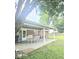 Covered back patio featuring an outdoor dining set, perfect for entertaining and relaxation at 731 Sunset Blvd, Greenwood, IN 46142