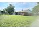 Expansive lawn showcases the home's exterior, highlighting the covered patio area at 731 Sunset Blvd, Greenwood, IN 46142
