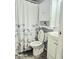 Bathroom featuring a toilet, sink, vanity, and shower with floral curtain design at 731 Sunset Blvd, Greenwood, IN 46142