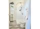 Bright bathroom features a modern shower, white vanity, and complementary gray floors at 731 Sunset Blvd, Greenwood, IN 46142