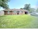 Brick home with a well-manicured lawn, attached garage, and a classic suburban appeal at 731 Sunset Blvd, Greenwood, IN 46142