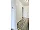 Hallway with wood-look floors leading to well-lit rooms at 731 Sunset Blvd, Greenwood, IN 46142