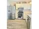 Well-lit kitchen with stainless steel appliances, ample counter space, and updated cabinetry at 731 Sunset Blvd, Greenwood, IN 46142
