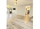 Spacious living room with contemporary flooring and neutral tones, seamlessly connecting to the kitchen at 731 Sunset Blvd, Greenwood, IN 46142