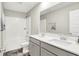 Bright bathroom features a double vanity with white countertops and gray cabinetry, plus a shower-tub combo at 741 Scarsdale Ln, Danville, IN 46122