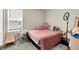 A bright bedroom features a window and neutral walls at 741 Scarsdale Ln, Danville, IN 46122