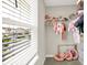 Cozy closet with an open window, complemented by soft, stylish decor, and ample storage space for a wardrobe at 741 Scarsdale Ln, Danville, IN 46122