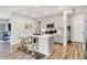 Bright kitchen features an island, stainless steel appliances, modern cabinets, and hardwood floors at 741 Scarsdale Ln, Danville, IN 46122