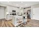 Bright kitchen with white cabinets, stainless steel appliances, and a center island, offering a functional and stylish cooking space at 741 Scarsdale Ln, Danville, IN 46122