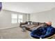 Living room featuring a plush sectional sofa, hardwood floors, natural light, and a accent chair at 741 Scarsdale Ln, Danville, IN 46122