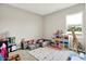 Spacious playroom filled with toys, colorful storage units, a cozy ball pit, and a large window at 741 Scarsdale Ln, Danville, IN 46122