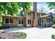 Backyard view featuring a brick house, a chimney, and a patio at 7648 W Williamswood Dr, New Palestine, IN 46163