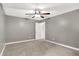Bedroom with ceiling fan, carpet, and adjacent doorway; a comfortable space with room to personalize at 7648 W Williamswood Dr, New Palestine, IN 46163