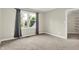 Bright bedroom with large window, neutral carpet and paint, plus ample space for furnishings at 7648 W Williamswood Dr, New Palestine, IN 46163