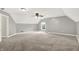 Spacious bedroom with a ceiling fan, large window, and neutral carpet at 7648 W Williamswood Dr, New Palestine, IN 46163