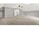 Large bedroom with neutral walls, a ceiling fan, and carpet at 7648 W Williamswood Dr, New Palestine, IN 46163