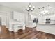 Bright eat-in kitchen with white cabinets, subway tile backsplash, modern appliances, and lots of counter space at 7648 W Williamswood Dr, New Palestine, IN 46163