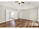 Large main bedroom with hardwood floors, trey ceiling, ceiling fan and access to a full bathroom at 7648 W Williamswood Dr, New Palestine, IN 46163