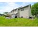 Spacious backyard with lush lawn and patio area at 7833 Meadow Bend Dr, Indianapolis, IN 46259