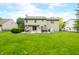 Lush backyard with patio, greenery, and ample space at 7833 Meadow Bend Dr, Indianapolis, IN 46259