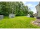 Lush backyard with shed and ample green space at 7833 Meadow Bend Dr, Indianapolis, IN 46259