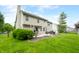 Backyard view featuring patio, mature trees, and landscaping at 7833 Meadow Bend Dr, Indianapolis, IN 46259