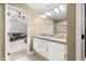 Bathroom with a double vanity and walk in shower with view of a living room space at 7833 Meadow Bend Dr, Indianapolis, IN 46259