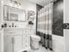 Updated bathroom showcasing vanity, square mirror and black marble-style shower at 7833 Meadow Bend Dr, Indianapolis, IN 46259