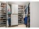 Organized walk-in closet featuring built-in shelving and hanging storage for clothing and shoes at 7833 Meadow Bend Dr, Indianapolis, IN 46259
