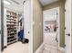Walk-in closet showing shelving and hanging storage with a view of the bedroom at 7833 Meadow Bend Dr, Indianapolis, IN 46259
