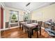 Dining area boasts natural light, and hardwood flooring throughout at 7833 Meadow Bend Dr, Indianapolis, IN 46259
