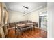 Charming dining room with tray ceiling, modern lighting, and hardwood floors at 7833 Meadow Bend Dr, Indianapolis, IN 46259