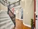 Elegant foyer with hardwood floors, staircase, and views to other rooms at 7833 Meadow Bend Dr, Indianapolis, IN 46259