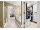 Long hallway featuring bathroom on one side and walk-in closet on the other at 7833 Meadow Bend Dr, Indianapolis, IN 46259