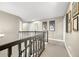 Second floor hallway with dark railings, neutral walls, and interior design at 7833 Meadow Bend Dr, Indianapolis, IN 46259