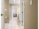 Hallway showcasing seamless flow and beautiful flooring that ties it all together at 7833 Meadow Bend Dr, Indianapolis, IN 46259