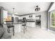 Open kitchen featuring white cabinetry and an attached breakfast nook, seamlessly flowing to the living area at 7833 Meadow Bend Dr, Indianapolis, IN 46259